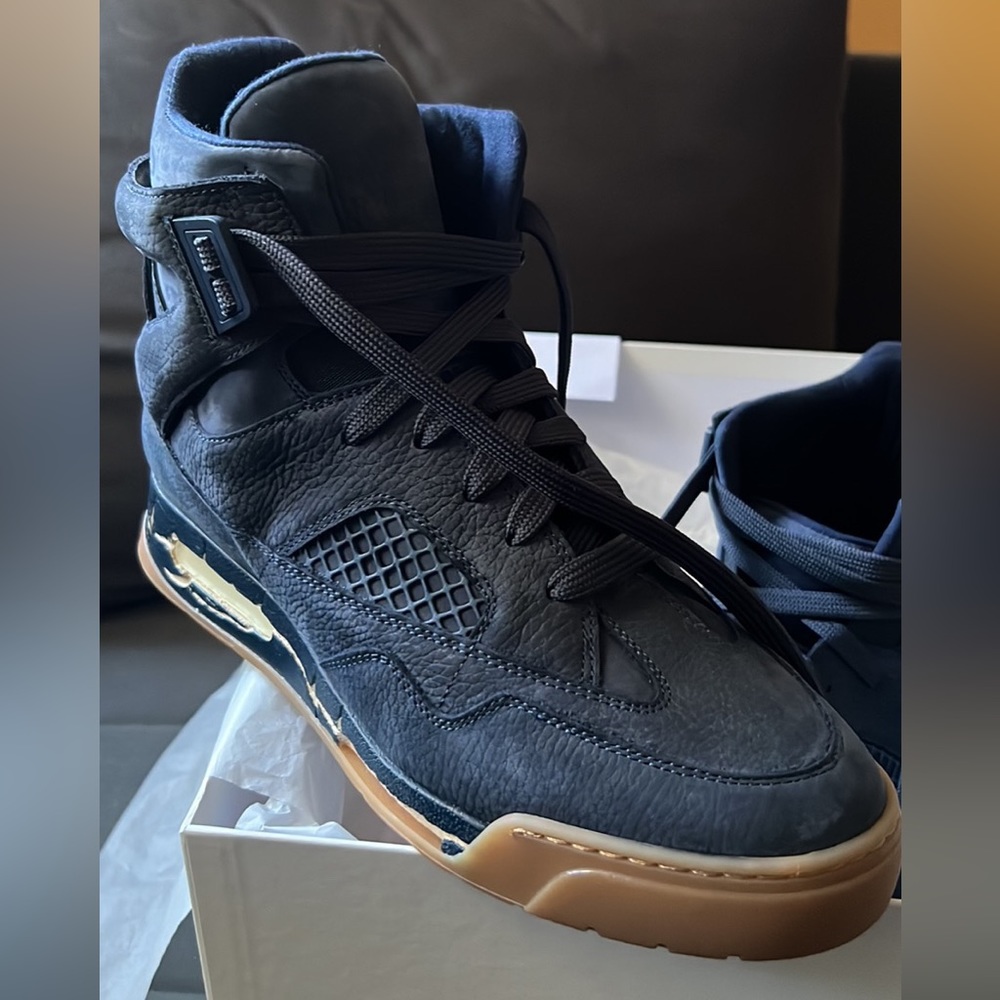 Maison Margiela hightop dead stick sneakers.